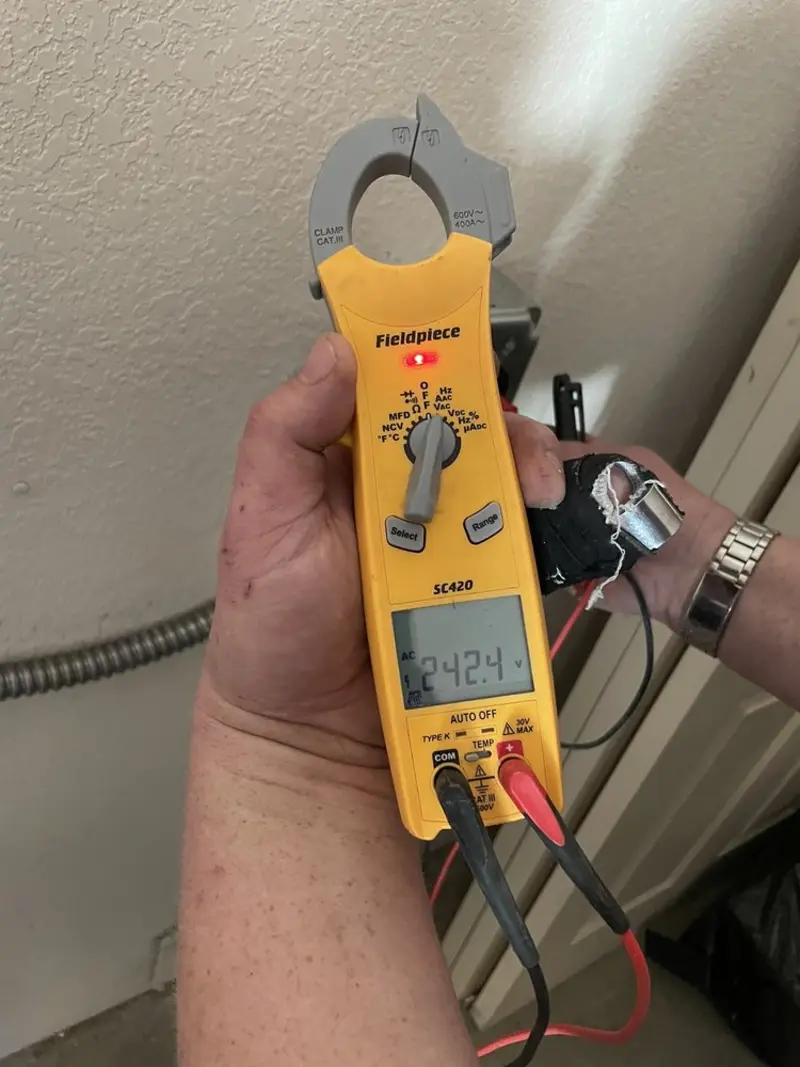 Voltage testing with clamp meter during Recessed Lighting Installation in Cortez